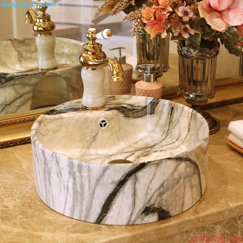 Jingdezhen ceramic art basin bathroom sinks on the basin that wash a face basin to hand gold-plated admiralty carve patterns or designs on woodwork