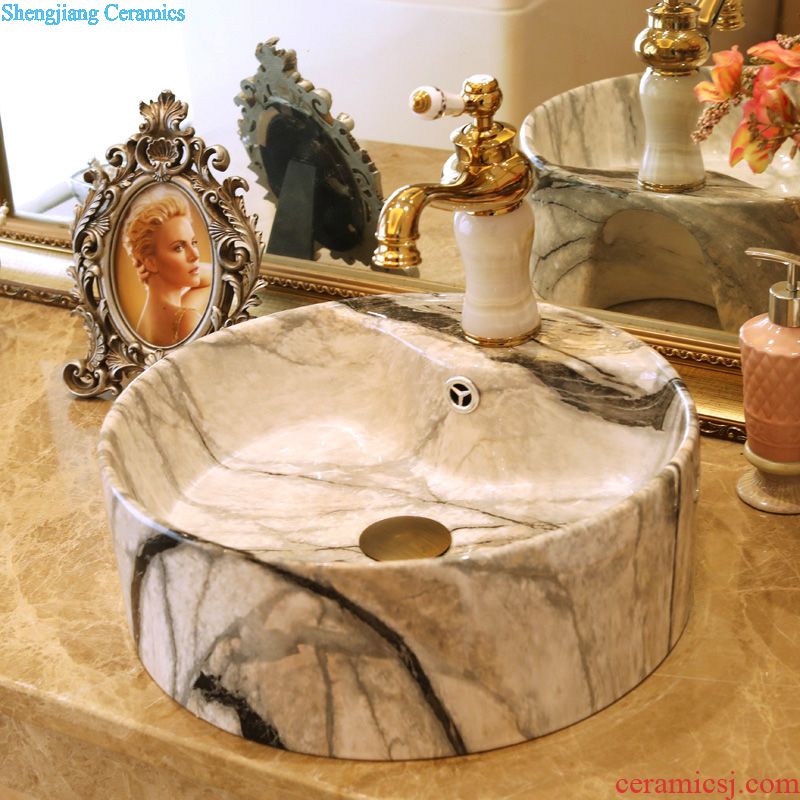 Jingdezhen ceramic art basin bathroom sinks on the basin that wash a face basin to hand gold-plated admiralty carve patterns or designs on woodwork