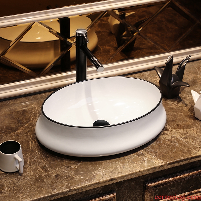 JingYan Nordic creative art stage basin oval ceramic lavatory household basin basin on the sink