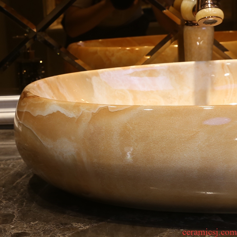 JingYan marble art stage basin ancient ceramic lavatory oval basin basin on the sink