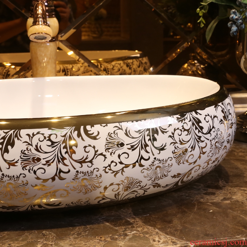JingYan European art of titanium coating on the stage basin oval ceramic lavatory household basin on the sink basin