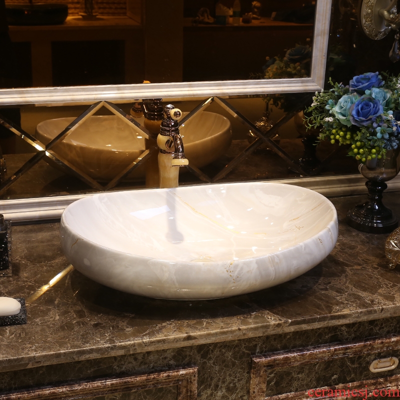 JingYan contemporary and contracted the stage basin to European art oval ceramic lavatory pan on the sink to wash your hands
