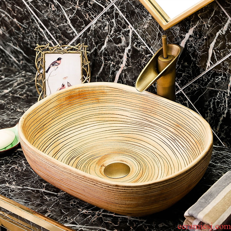 The stage basin oval ceramic lavatory wiredrawing basin of Chinese style antique art creative home toilet lavabo