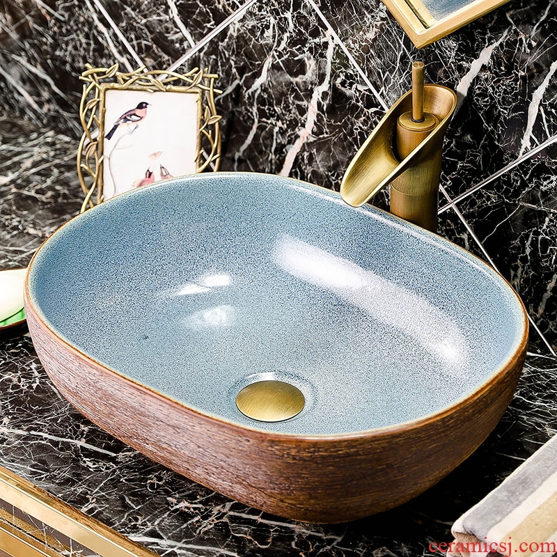 Ceramic sink on stage basin oval plate of the pool that wash a face Chinese creative household toilet bathroom art