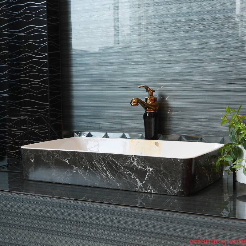 Contracted on the ceramic bowl lavatory square black marble basin of household toilet lavabo art