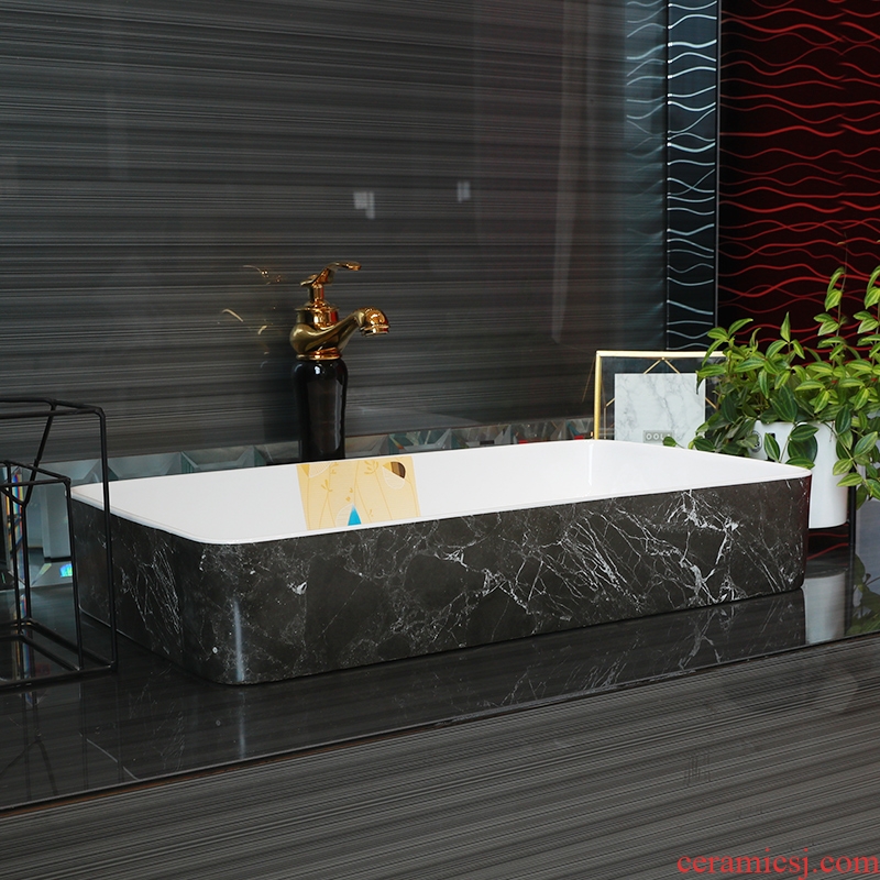 Contracted on the ceramic bowl lavatory square black marble basin of household toilet lavabo art