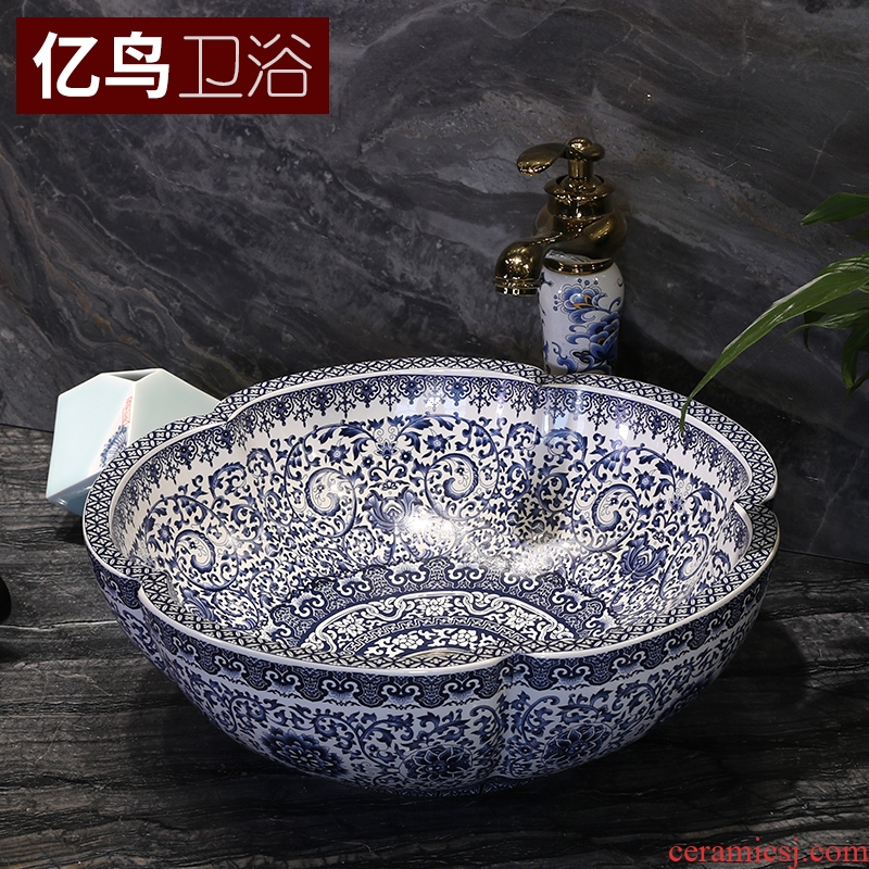 Million birds on the blue and white porcelain basin jingdezhen ceramic lavatory basin of Chinese style art basin petals round the sink