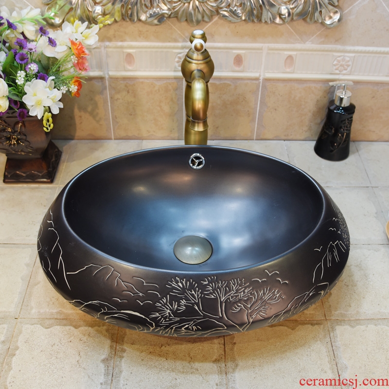 Jingdezhen ceramic lavatory basin basin art on elliptic black rock landscape
