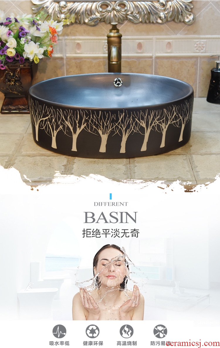 Jingdezhen ceramic lavatory basin stage basin, art basin sink elliptic black poplar belt spilled water