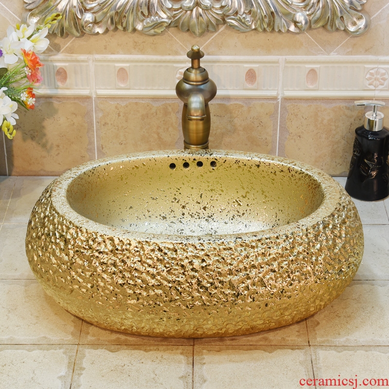 Jingdezhen ceramic lavatory basin basin sink art on elliptic gold - plated with excessive water basin
