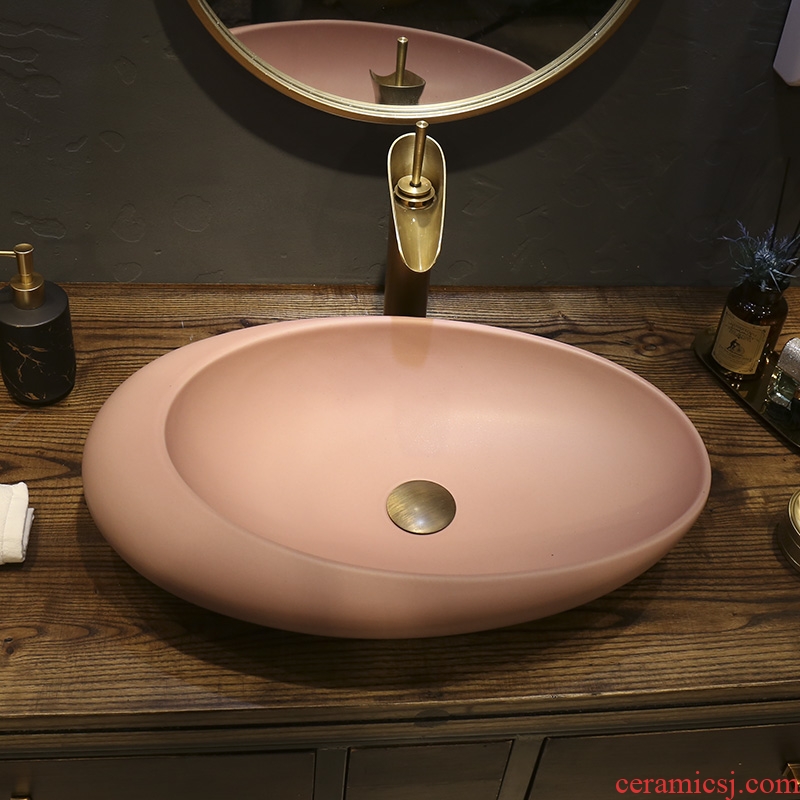 Creative oval household washing basin, art basin ceramic lavatory toilet Nordic stage basin on the balcony