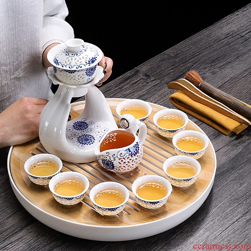 Tang Xian a complete set of blue and white semi - automatic tea sets ceramic tea set against the very hot creative tea set lazy person household make tea