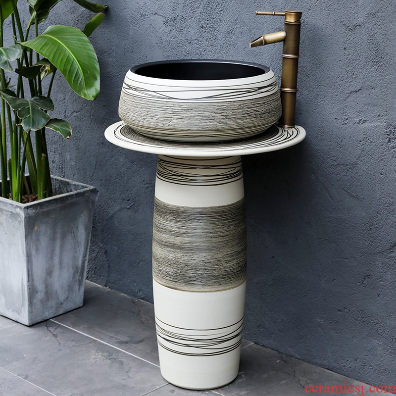 The Nordic pillar type lavatory is suing floor ceramic wash basin balcony garden bathroom sink
