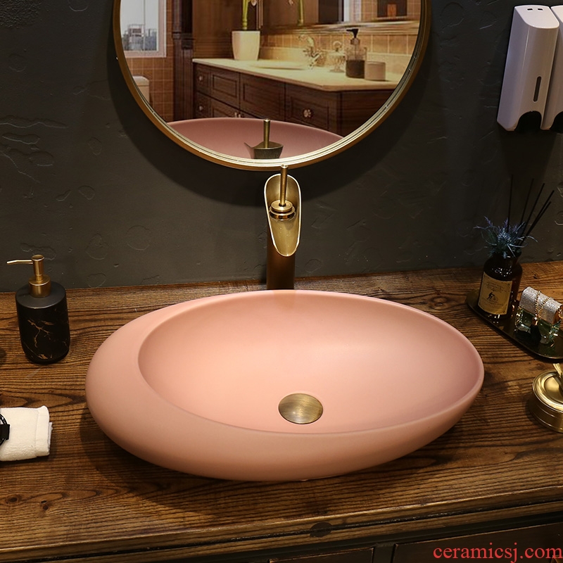Creative oval household washing basin, art basin ceramic lavatory toilet Nordic stage basin on the balcony