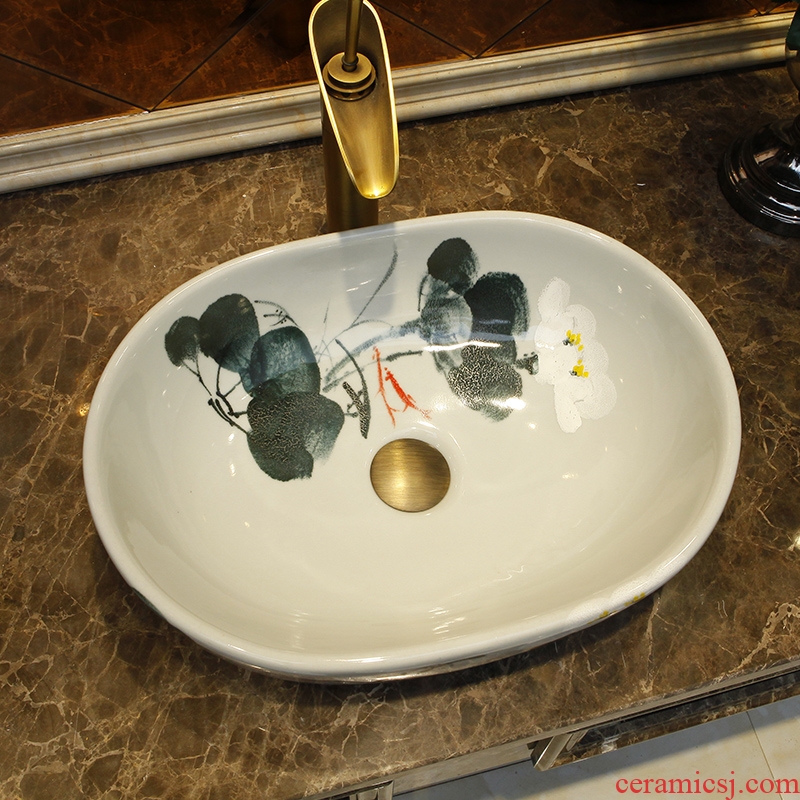 Contracted ceramic water basin on the basin washing a face small elliptic shape household washing basin bathroom art basin