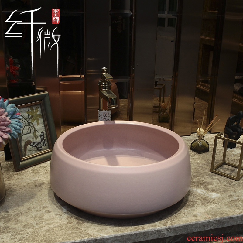 On the pink ceramic POTS round European art basin sink basin bathroom sinks counters are contracted