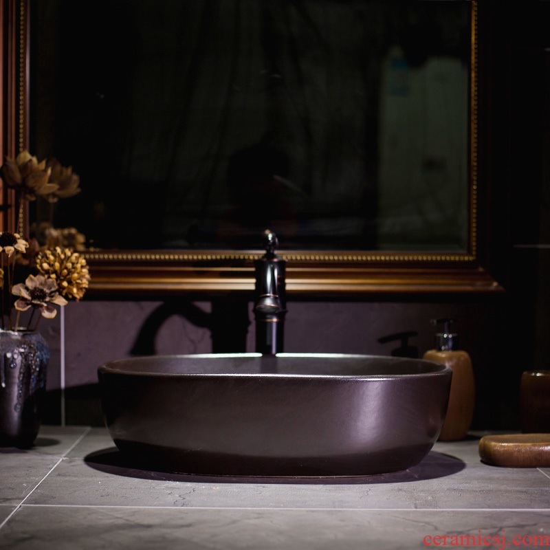 Black metal basin on its European ceramic glaze art petals lavatory basin basin on the sink