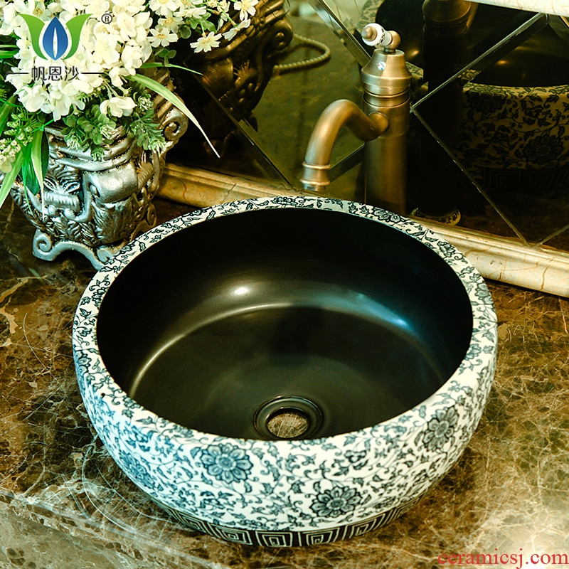 On the ceramic art basin circular lavatory basin round basin toilet water basin the sink of the basin that wash a face