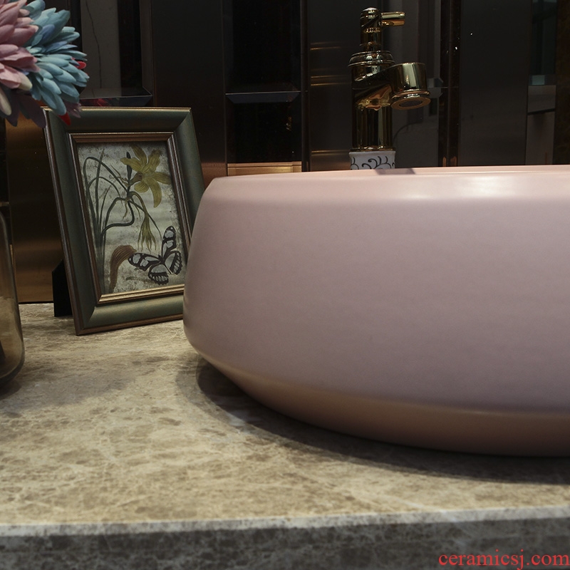 On the pink ceramic POTS round European art basin sink basin bathroom sinks counters are contracted