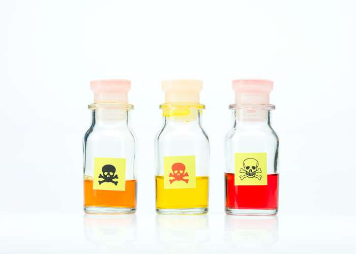 Toxins and chemicals in bottles. Exposure to toxins can destroy body system and immunity, causing diseases and illnesses.