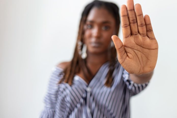 woman-raised-her-hand-dissuade-campaign-stop-violence-against-women-african-american-woman-raised-her-hand-dissuade-with-copy-space