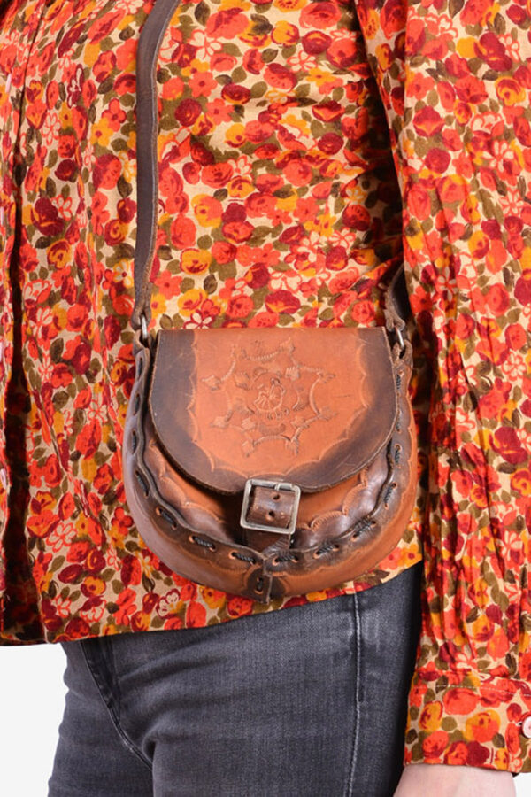 Vintage small tooled leather saddle bag