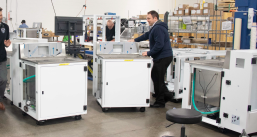 A program manager handling a customer's finished machinery in the final assembly and systems integration facility prior to shipment