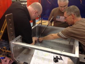 Engineers Inspecting Welded Sheet Metal Fabrication