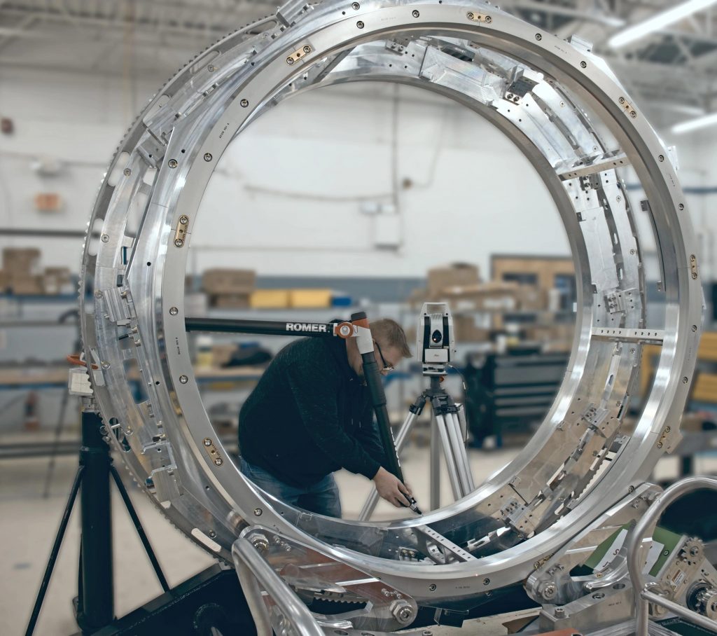 Quality Control Personnel checking assembly for medical company. 