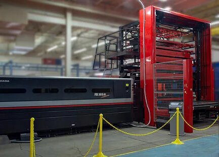 Large red AMADA laser CNC with side stacker for automation for in-house fabrication