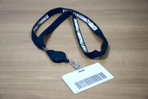 Employee badge with clearly marked PEKO lanyard for identification and access into building