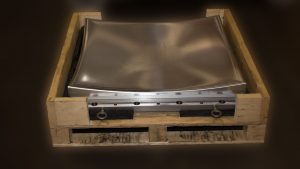 CNC machined concave metal part in pallet box for shipment 