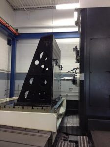 Large boring mill machining a metal plate