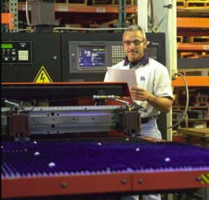 Engineer setting up CNC machine