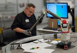 Portable CMM inspecting some Precision Fabrications