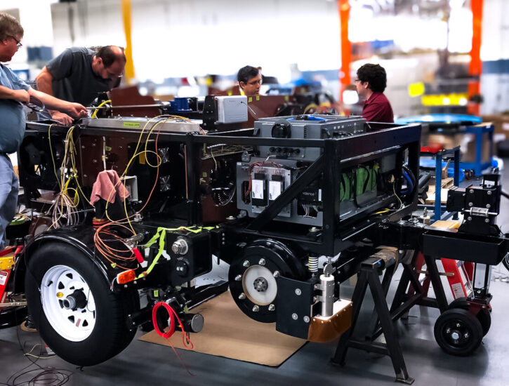 PEKO's NPI engineers working on building a prototype unit of rail inspection equipment