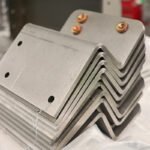 Stack of sheet metal flange parts for press brake forming applications.