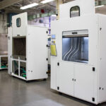 Multiple enclosed post-processing equipment assemblies on the PEKO NPI manufacturing floor