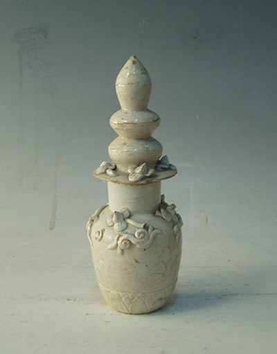 Bluish white glaze soul bottle with heaping flowers and cover