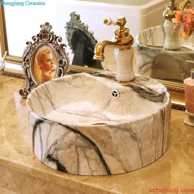 Jingdezhen ceramic art basin bathroom sinks on the basin that wash a face basin to hand gold-plated admiralty carve patterns or designs on woodwork