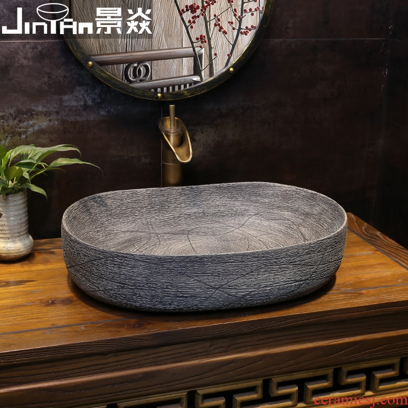 JingYan carved lines antique art stage basin oval ceramic lavatory household archaize on the sink