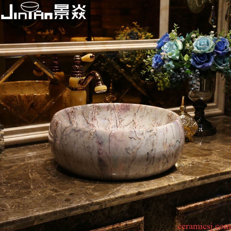 JingYan marble art stage basin restoring ancient ways round ceramic lavatory toilet stage basin on the sink