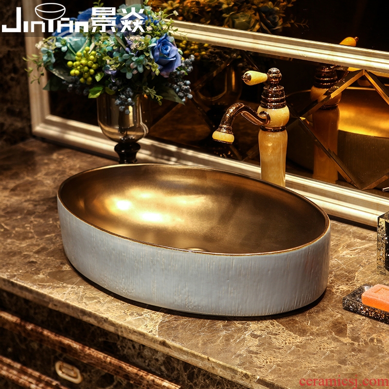 JingYan blue gold wood art stage basin to creative ceramic sinks oval restoring ancient ways on the sink