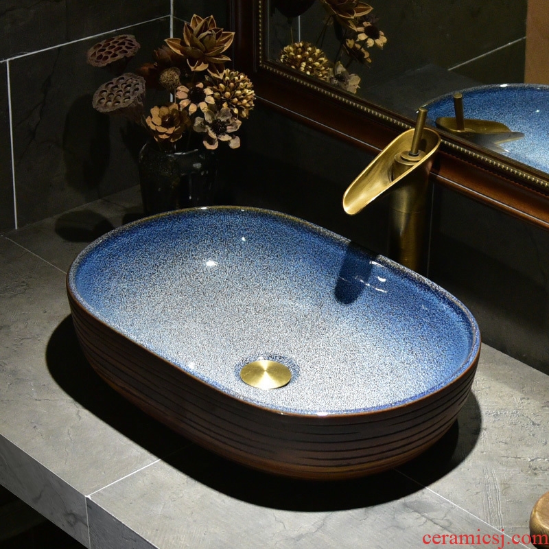 The stage basin sink oval ceramic basin small household bathroom sinks American art continental basin