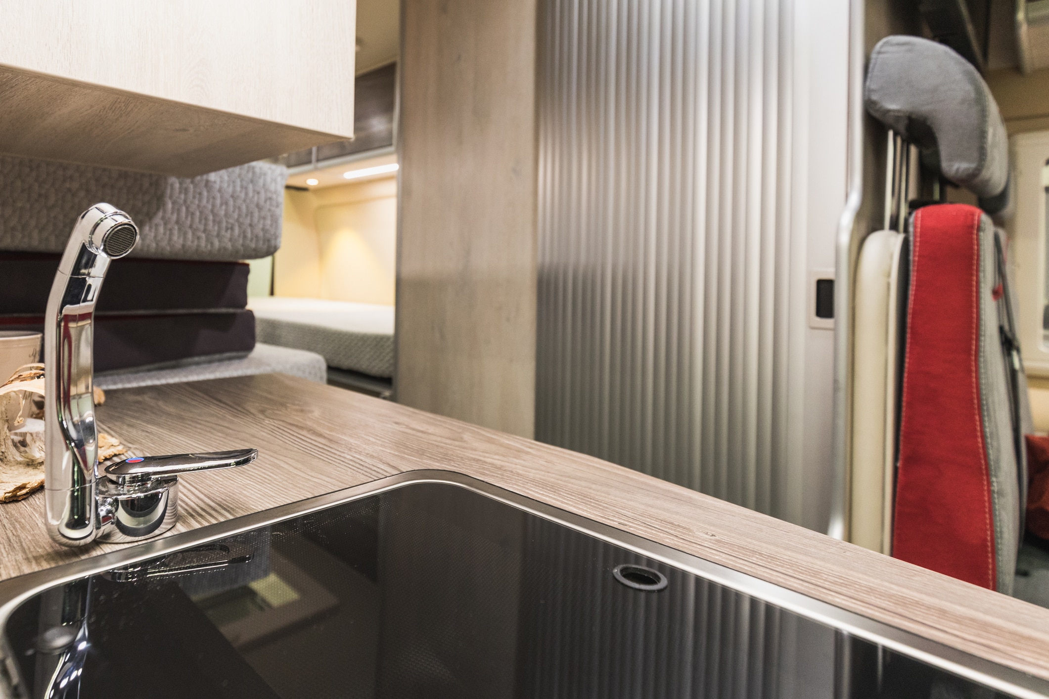 detailed view of a water tap in the kitchen inside a caravan, switzerland