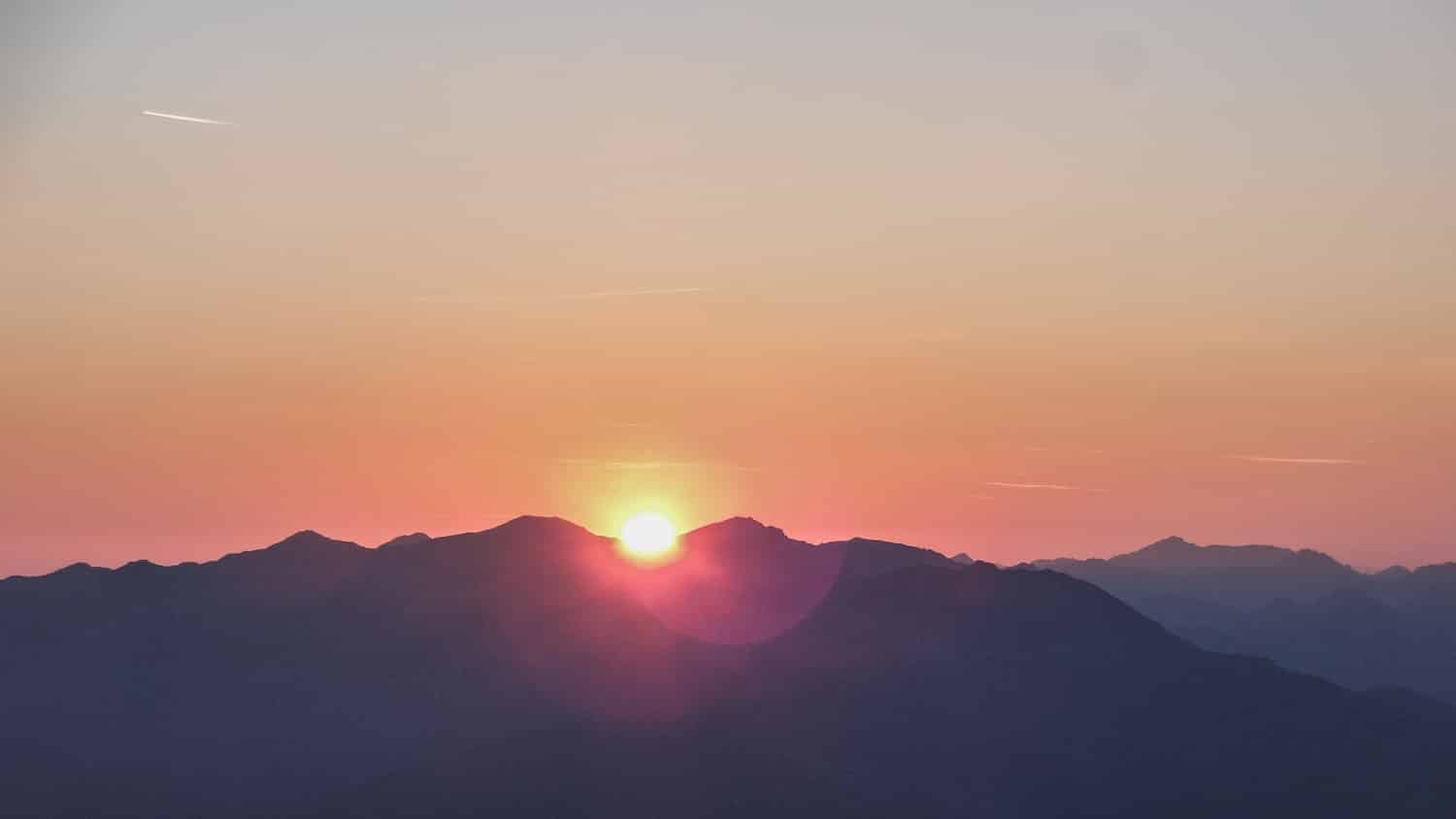 A sunrise over a mountain top