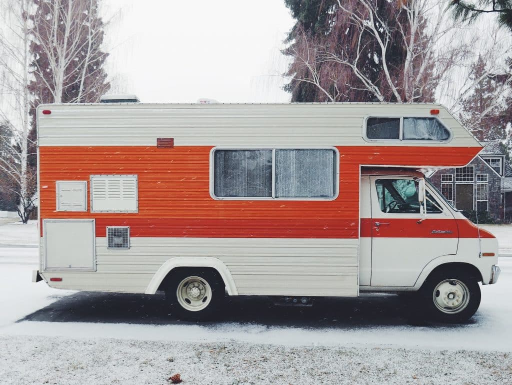 Older RV in the snow