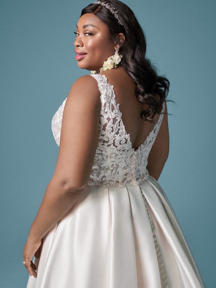 Curvy Model Wearing Plus Size Satin Princess Wedding Gown Called Sonnet by Maggie Sottero