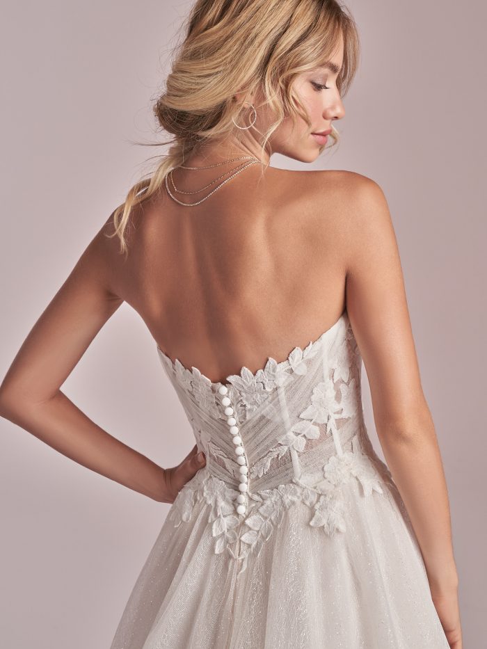 Model Wearing Affordable Strapless Princess Wedding Dress Called Remy by Rebecca Ingram