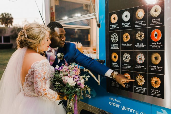 Groom with Real Bride Ordering from Unique Donut Truck at Real Wedding